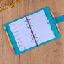 NOTIQUE Refill – Týdenní kroužkový diář s vyměnitelnými listy 2027, tyrkysový, 12,5 x 19 cm